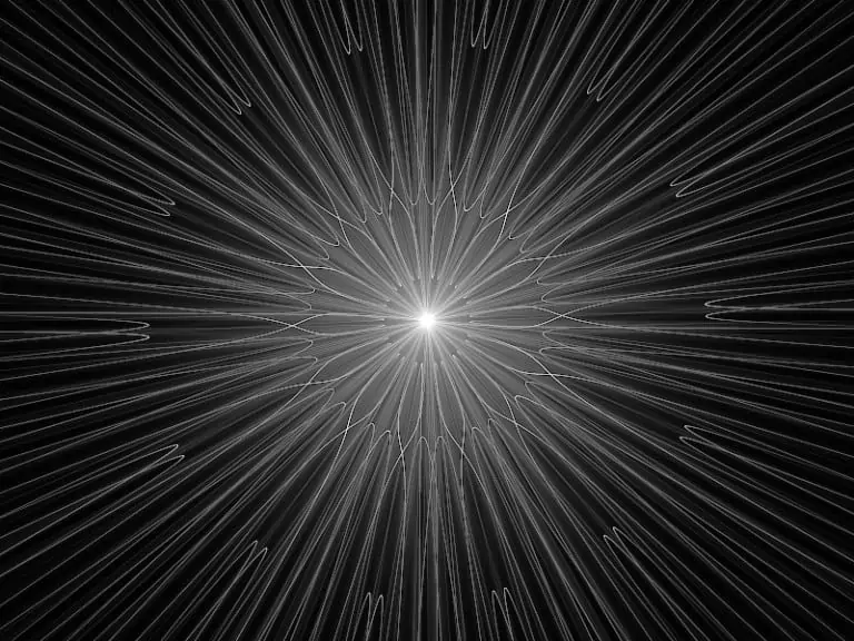 Radiating white lines form a starburst pattern on a black background, creating a sense of motion and depth.